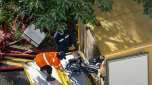 Incendie de Hong Kong: au moins 128 morts, l'angoissante recherche des disparus