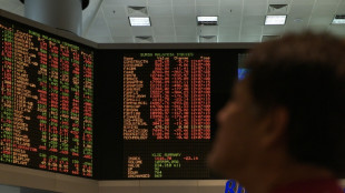 Asian markets waver to start key week for trade, US data