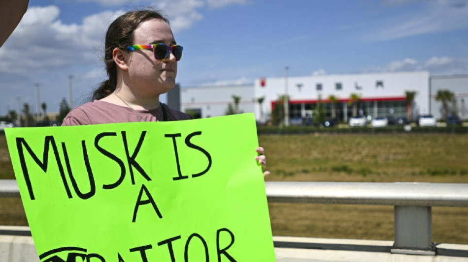 Protesters denounce Musk at Tesla dealerships in US, Europe, Canada