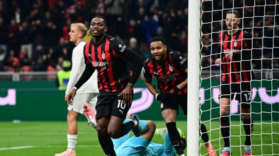 AC Milan take Serie A lead after fraught win over Lazio