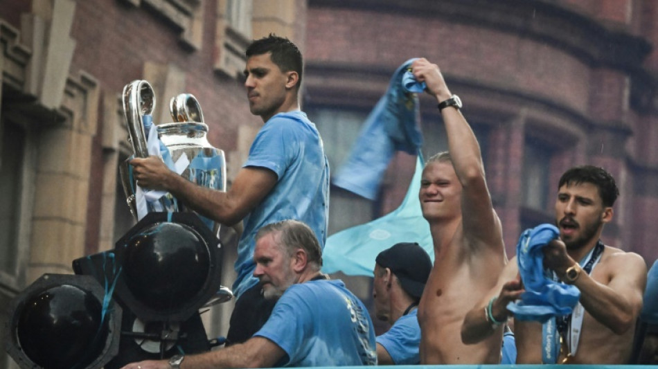 Angleterre: la liesse de Manchester City pas douch&eacute;e par la pluie