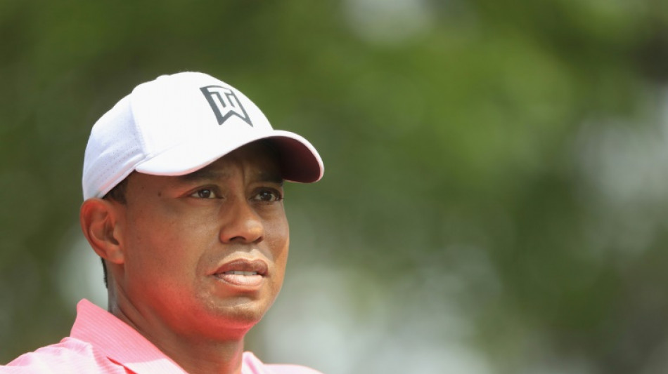 Tiger Woods appears fit for return after caddie role for son
