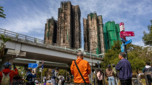 'Tormenting': Relatives search through images of the dead after Hong Kong blaze