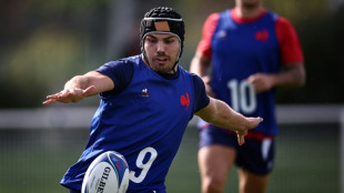 France's Dupont trains with headguard before World Cup quarter-final