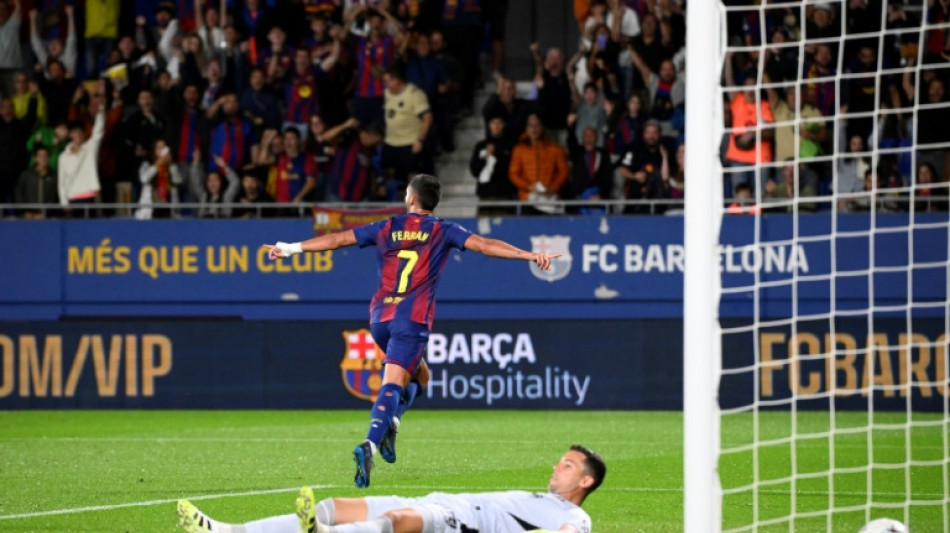 Torres double helps Barca down listless Getafe